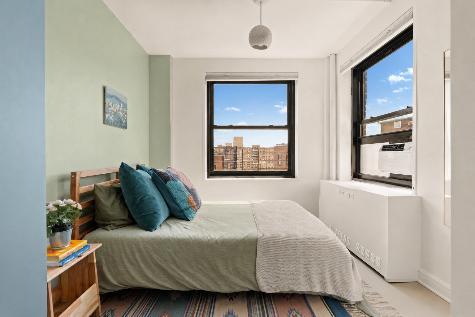 185 Clinton Avenue, Unit 14F Brooklyn, NY 11205 - Photo 5 of 9 a bedroom with a bed and a window