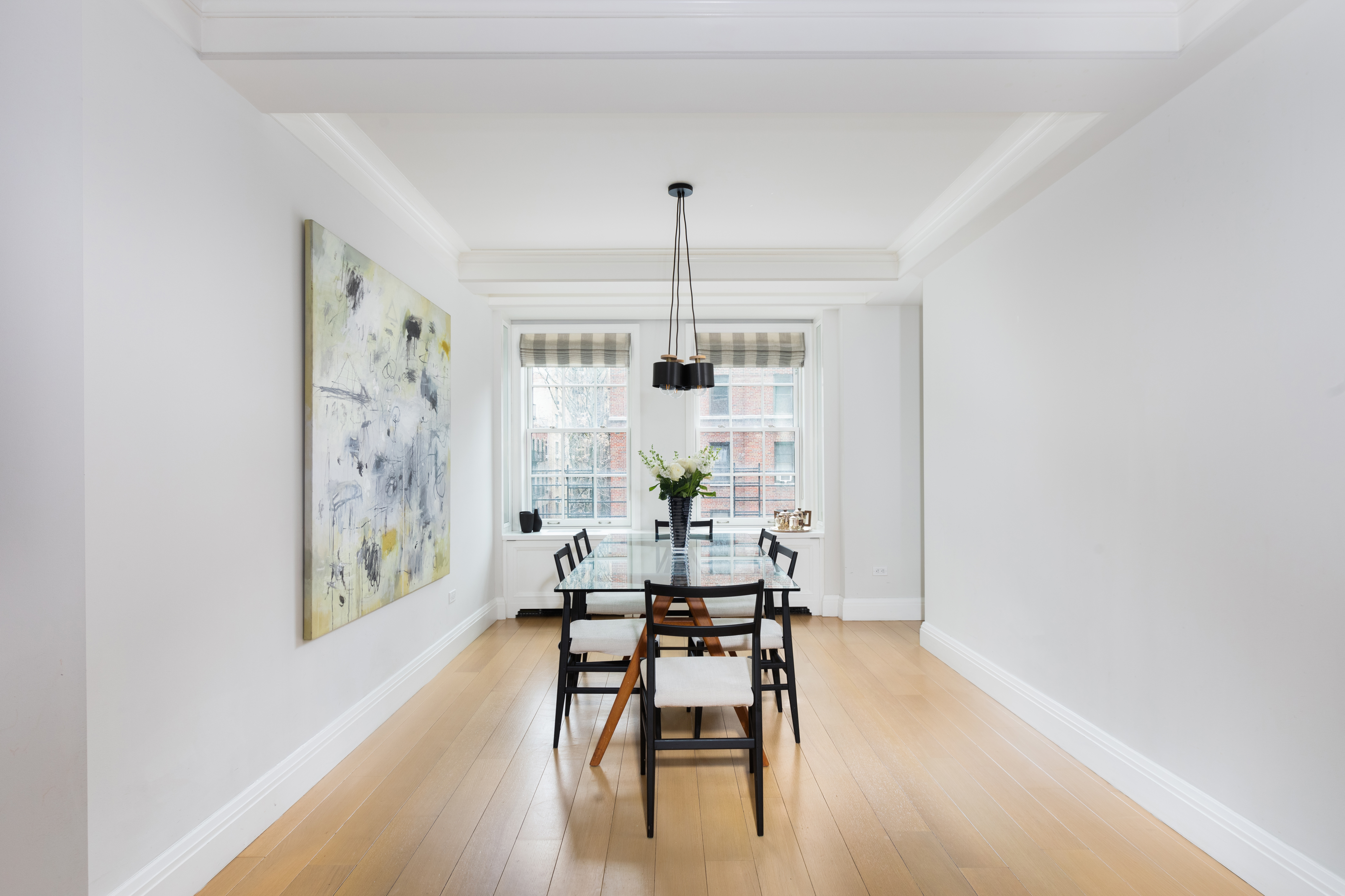 141 East 88th Street, Unit 5 Manhattan, NY 10128 - Photo 2 of 12 a dining room with furniture and wooden floor
