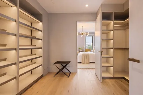 a room with wooden floor and furniture