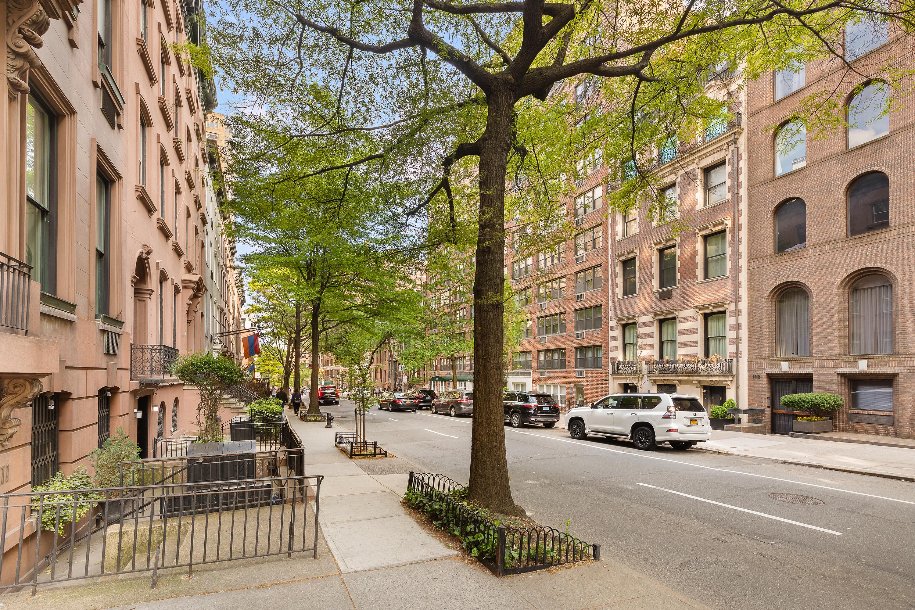 111 East 36th Street, Unit 4A Manhattan, NY 10016 - Photo 15 of 19 a city street lined with parked cars and buildings