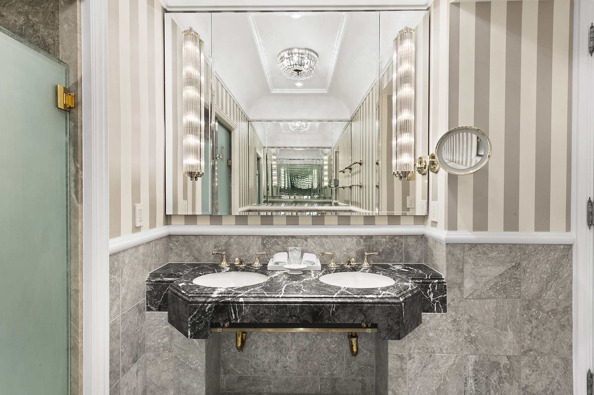 2 East 55th Street, Unit 909W14 Manhattan, NY 10022 - Photo 4 of 11 a bathroom with a sink and a mirror