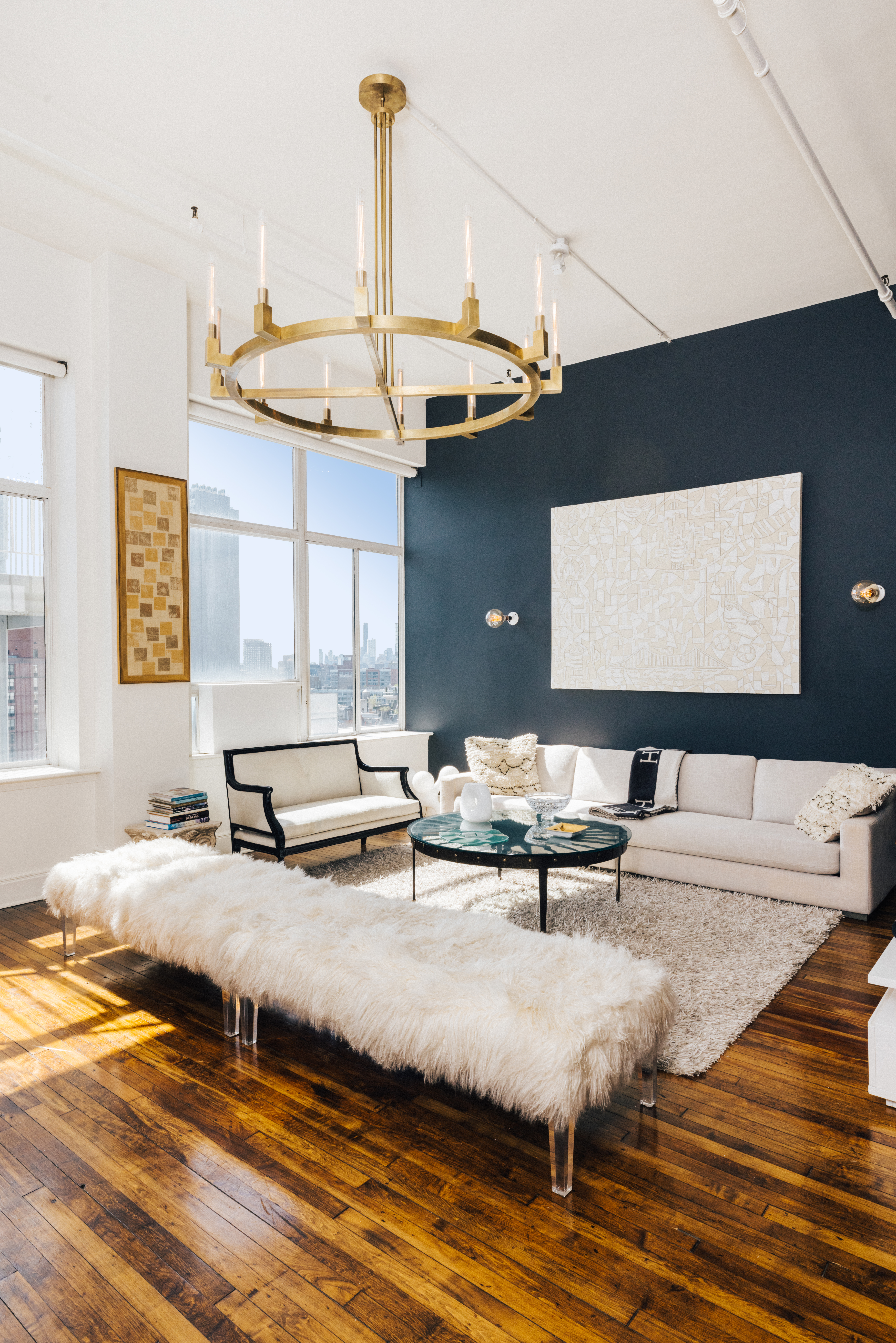 718 Broadway, Unit PHC Manhattan, NY 10003 - Photo 3 of 21 a living room with couch and a flat screen tv