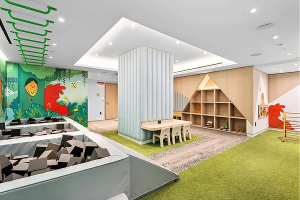 a room with furniture and gym equipment