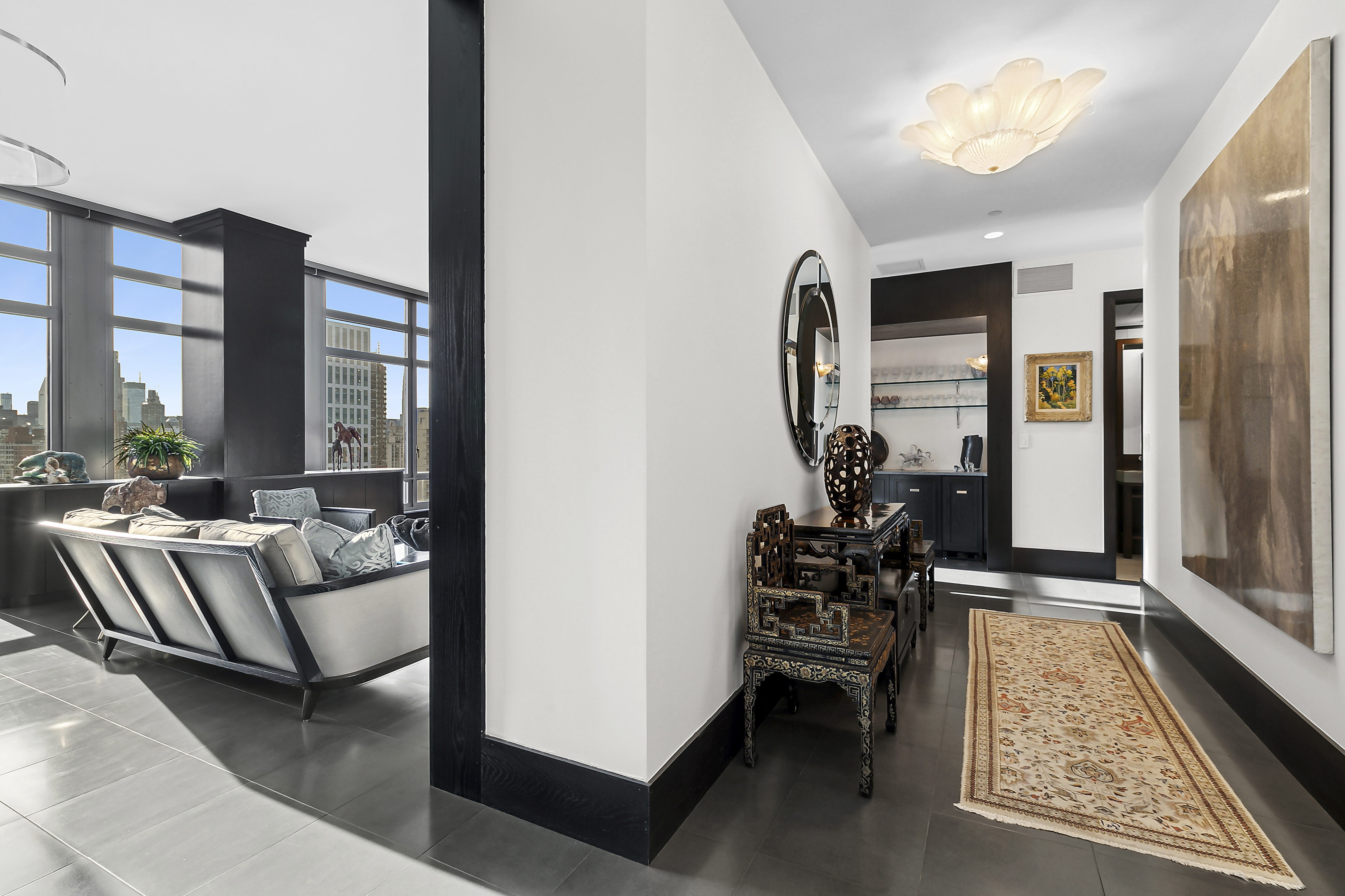 450 East 83rd Street, Unit PH1B Manhattan, NY 10028 - Photo 14 of 15 a living room with furniture and a large window