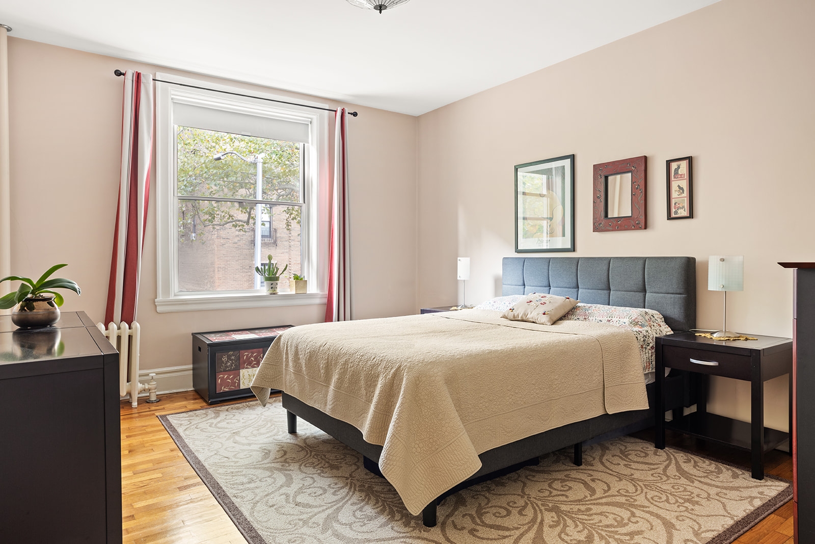 35-56 79th Street, Unit 22 Queens, NY 11372 - Photo 6 of 14 a bedroom with a large bed and a window