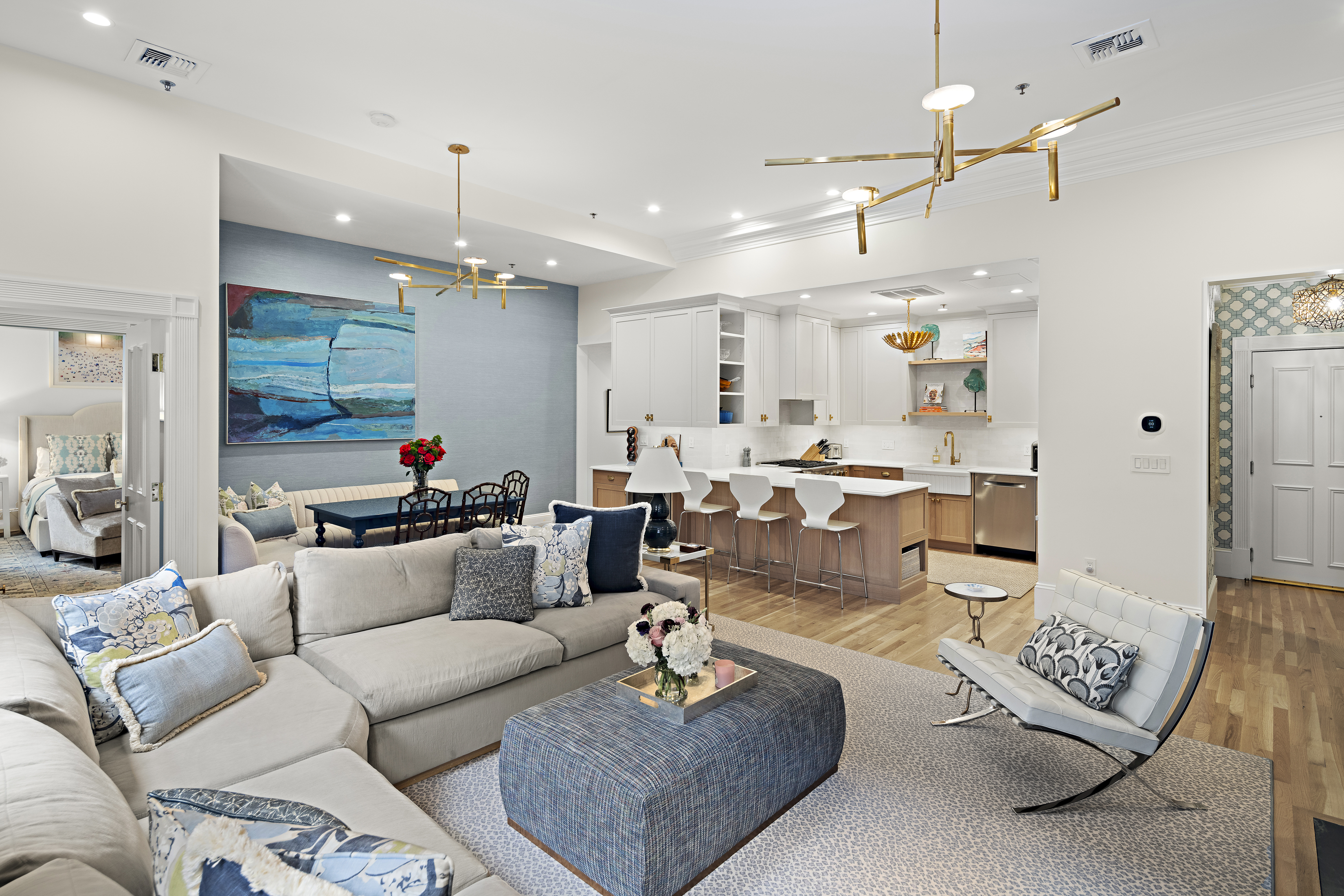 41-43 Phillips Street, Unit 4 Boston, MA 02114 - Photo 2 of 9 a living room with furniture kitchen view and a chandelier