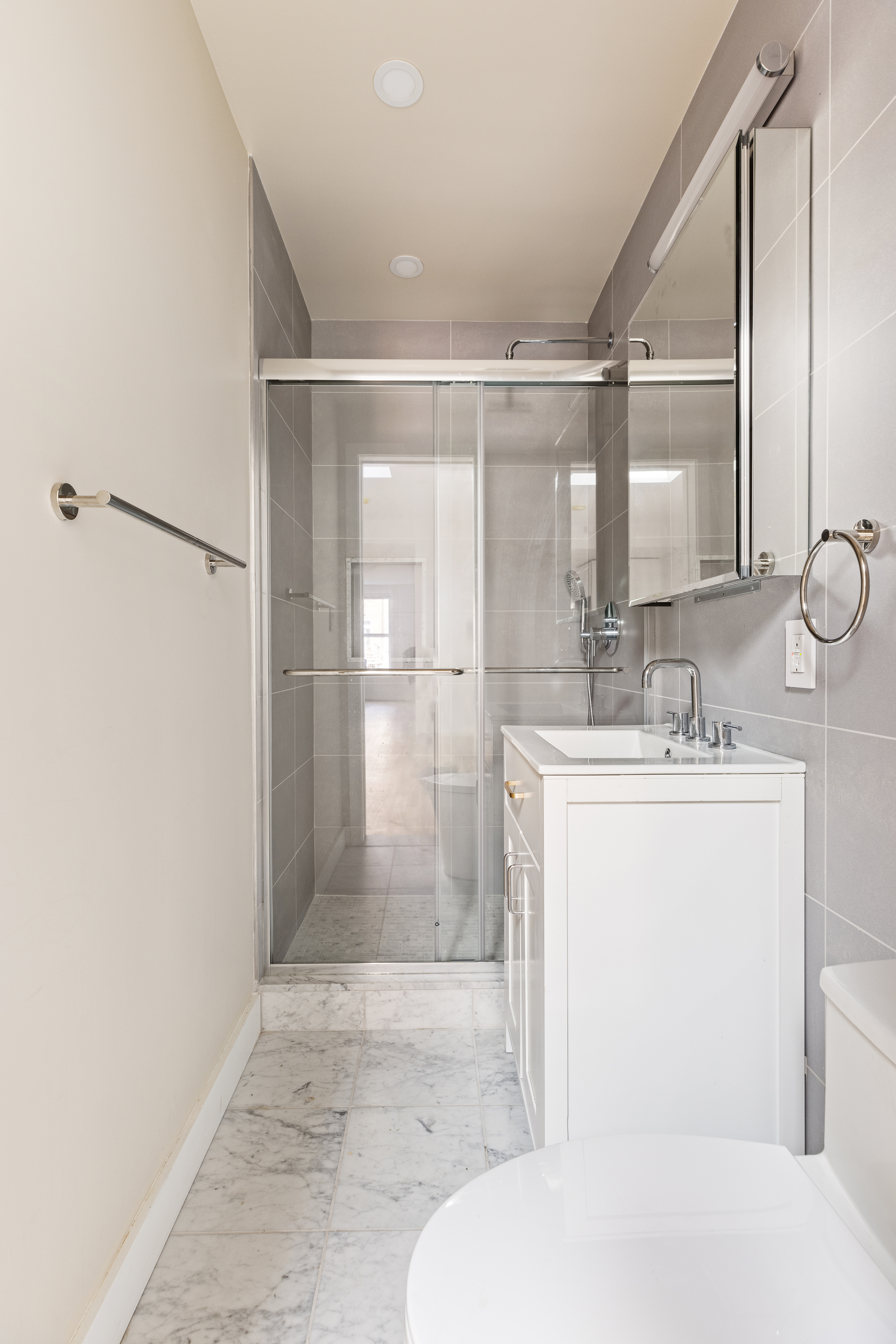 147 Atlantic Avenue, Unit 2 Brooklyn, NY 11201 - Photo 5 of 8 a bathroom with a sink a toilet and shower