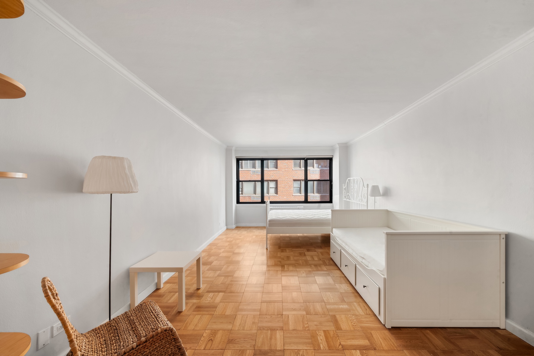 301 East 64th Street, Unit 4J Manhattan, NY 10065 - Photo 1 of 5 a view of a bedroom with furniture and a bathtub