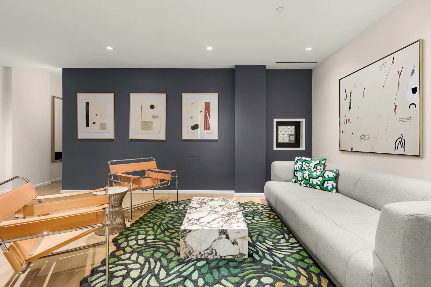 a living room with furniture and a rug