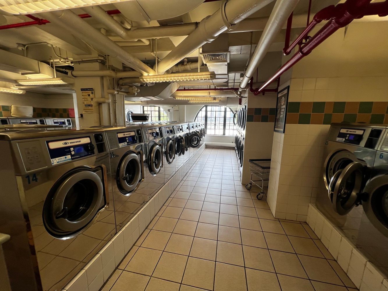 5 Tudor City Place, Unit 1518 Manhattan, NY 10017 - Photo 6 of 9 a utility room with dryer washer and other items