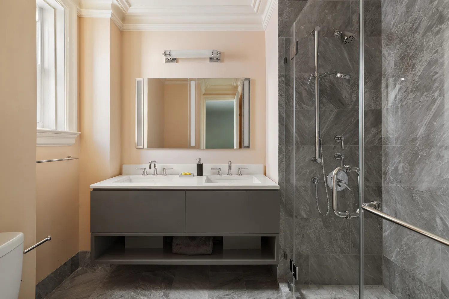 a bathroom with a sink a mirror and a shower