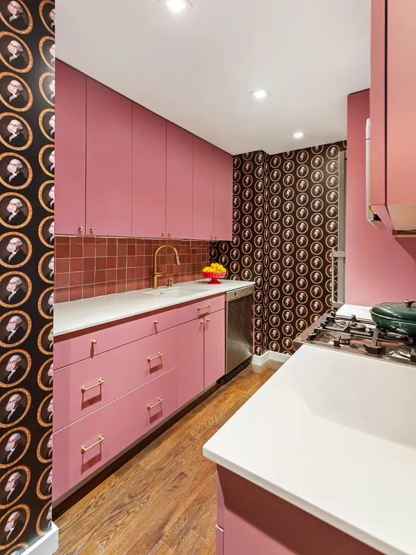a kitchen with a sink a stove and a cabinets