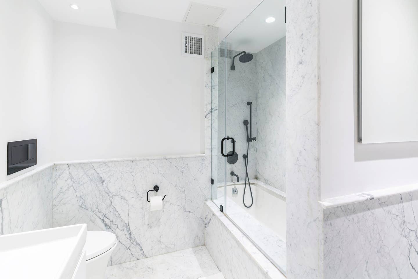 265 East Houston Street, Unit 4 Manhattan, NY 10002 - Photo 13 of 20 a bathroom with a bathtub and shower