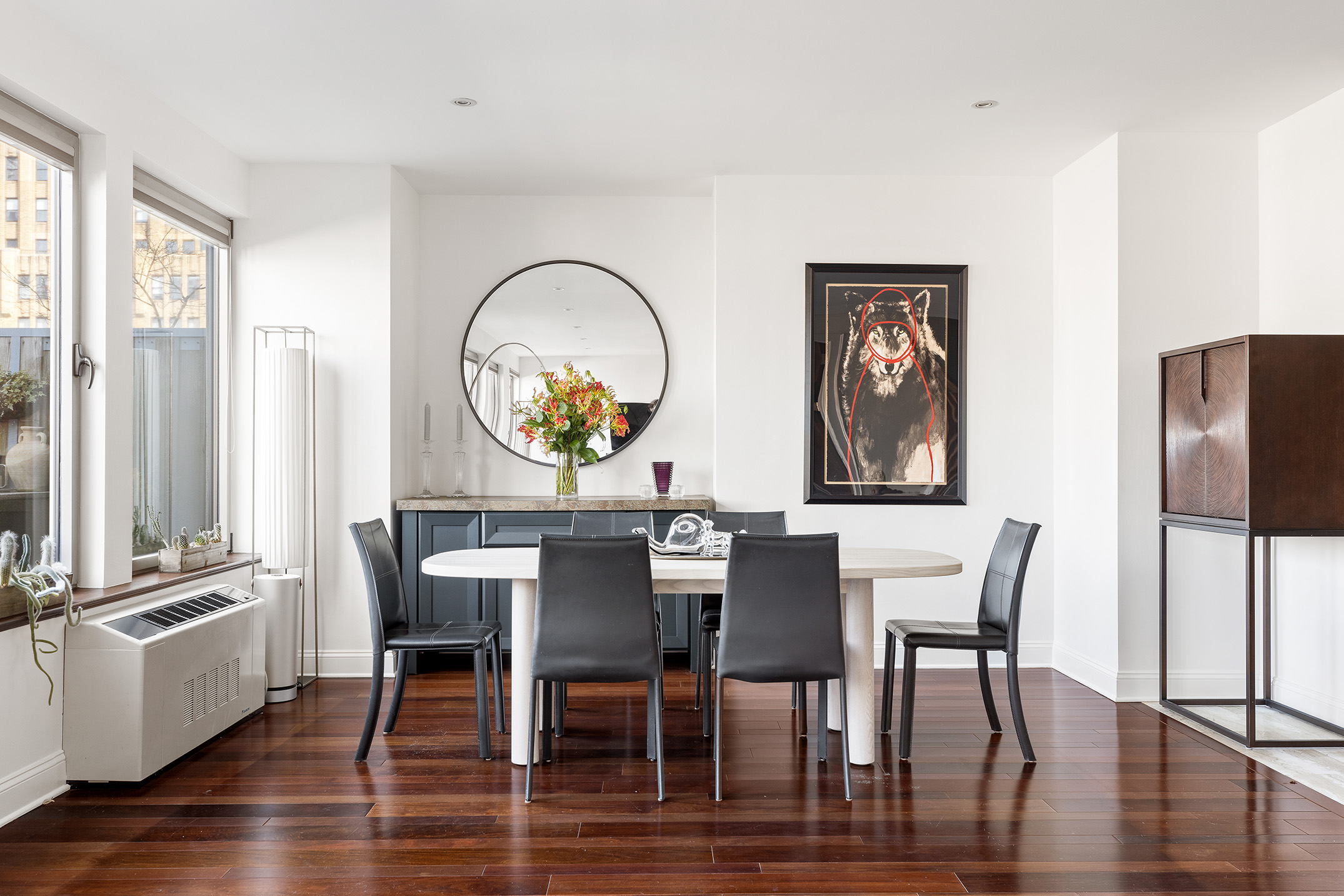 252 7th Avenue, Unit PHG Manhattan, NY 10001 - Photo 8 of 27 a view of a dining room with furniture window and wooden floor