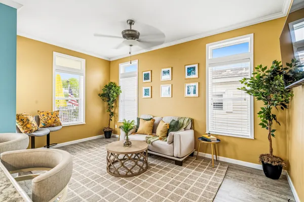 a bedroom with a bed and ceiling fan