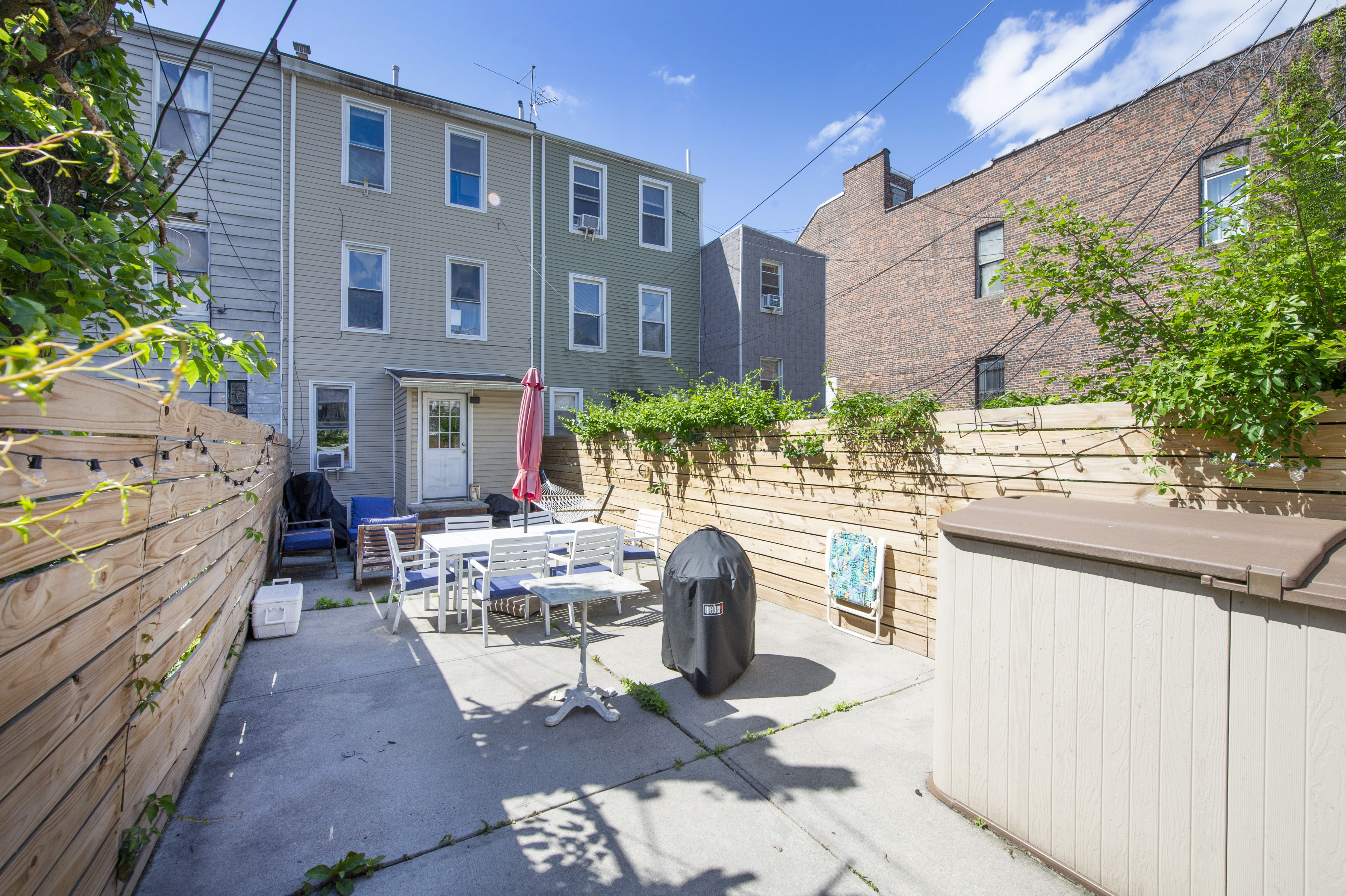 185 A Powers Street, Unit 1 Brooklyn, NY 11211 - Photo 7 of 13 a front view of a building with outdoor seating
