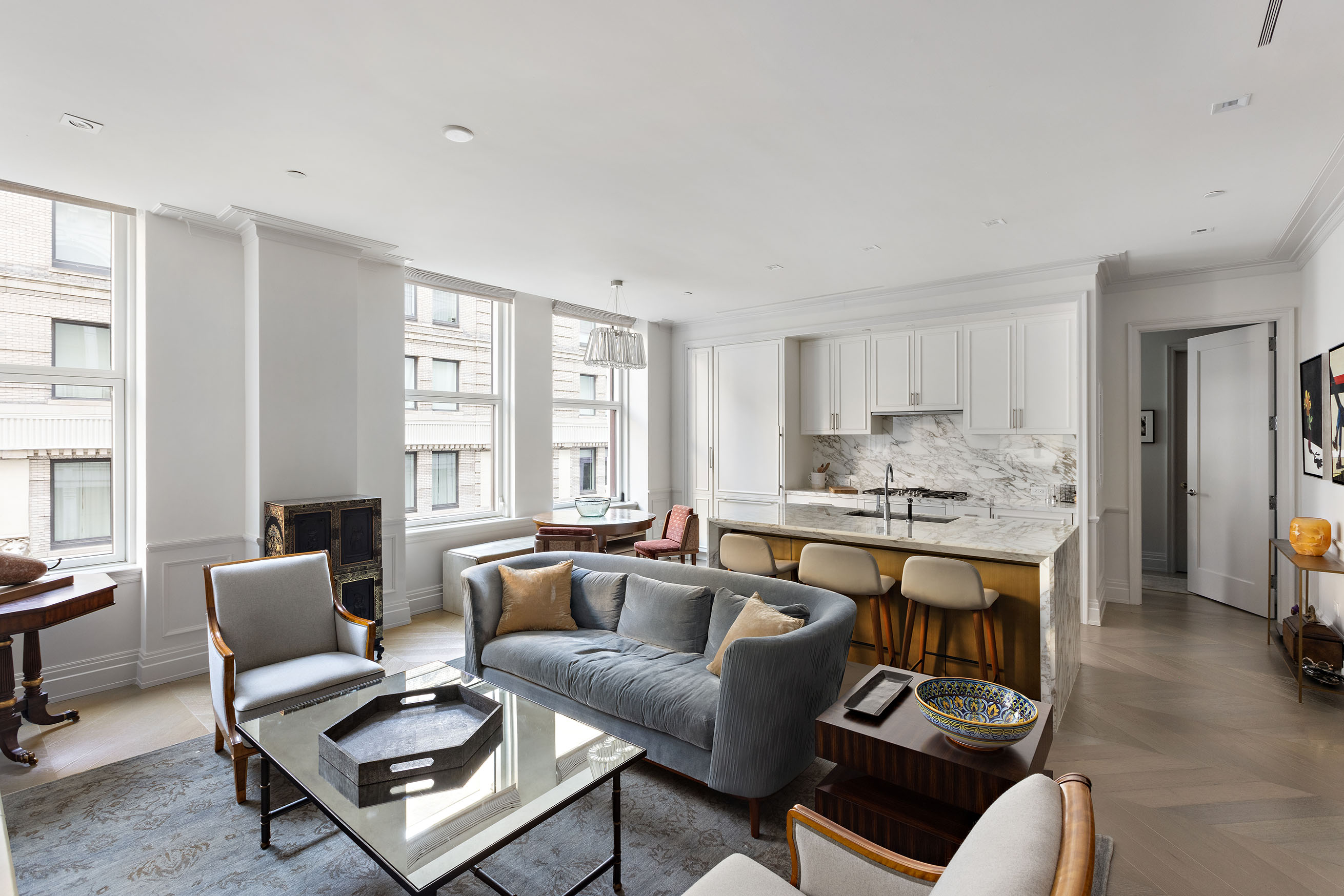 108 Leonard Street, Unit 9B Manhattan, NY 10013 - Photo 6 of 13 a living room with furniture and a large window