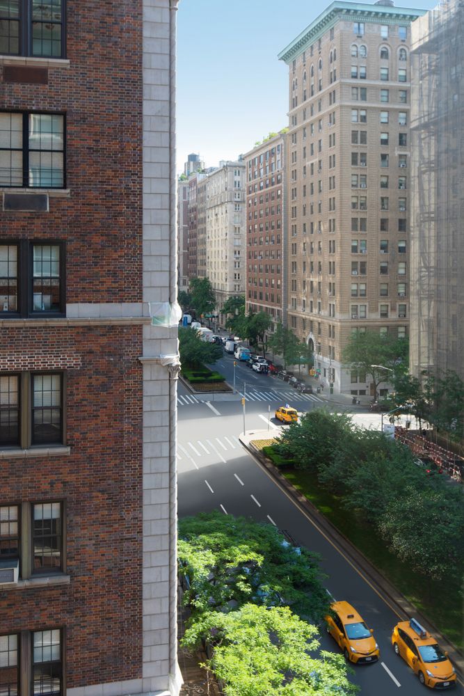876 Park Avenue, Unit 7N Manhattan, NY 10075 - Photo 17 of 21 a backyard of a house with lots of green space and plants