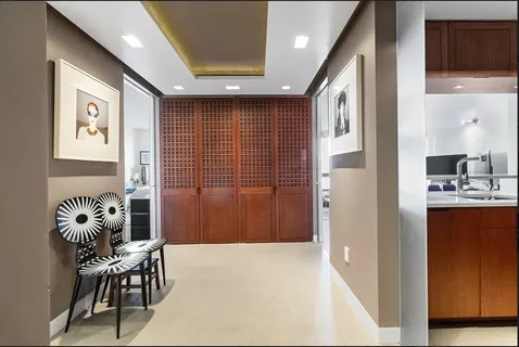 a balcony with furniture and wooden floor