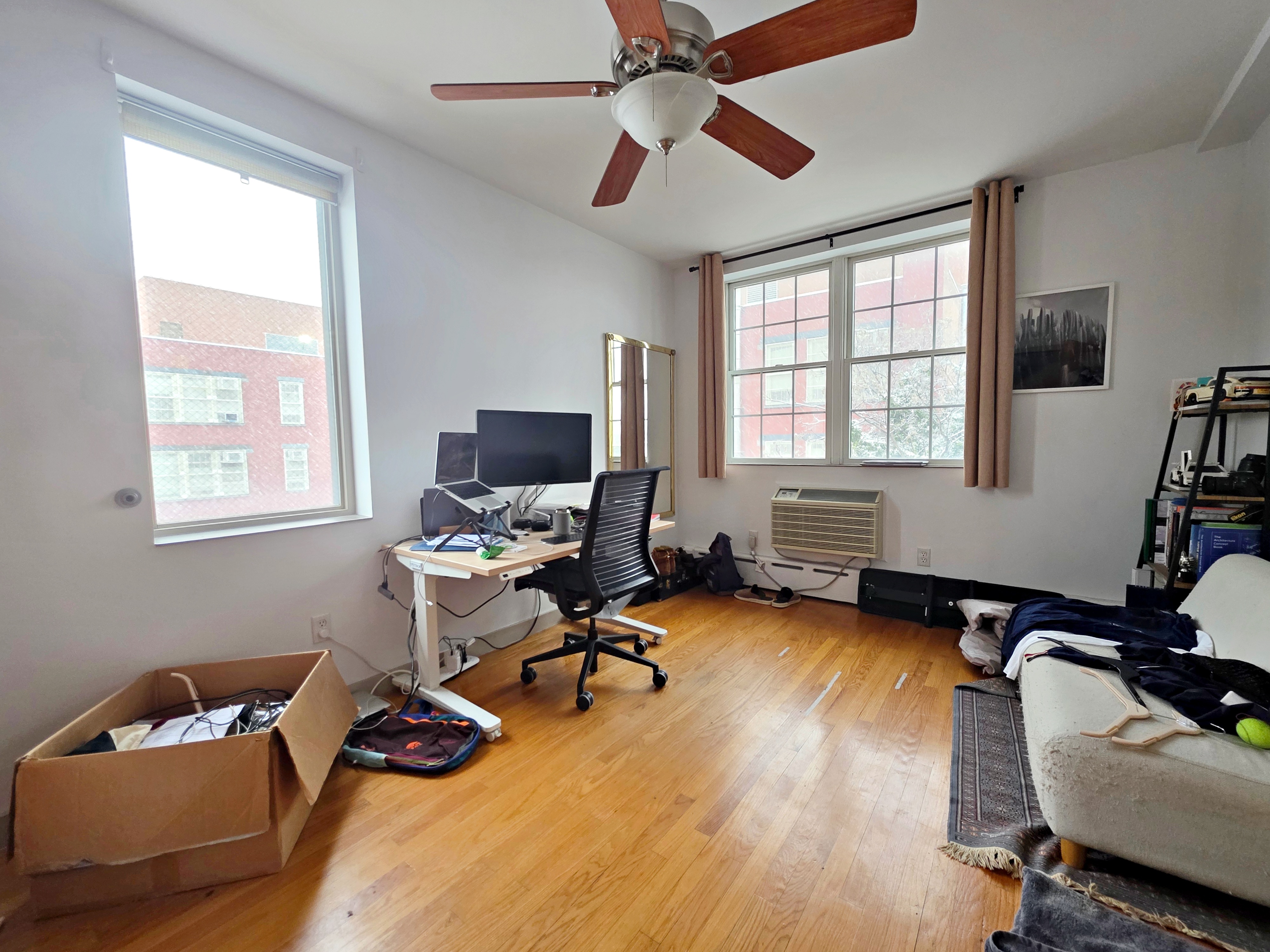 713 Metropolitan Avenue, Unit 4R Brooklyn, NY 11211 - Photo 8 of 11 a view of a livingroom with workspace and a window