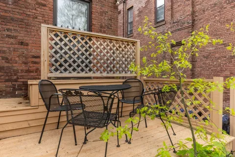 a view of a chairs and table in the patio