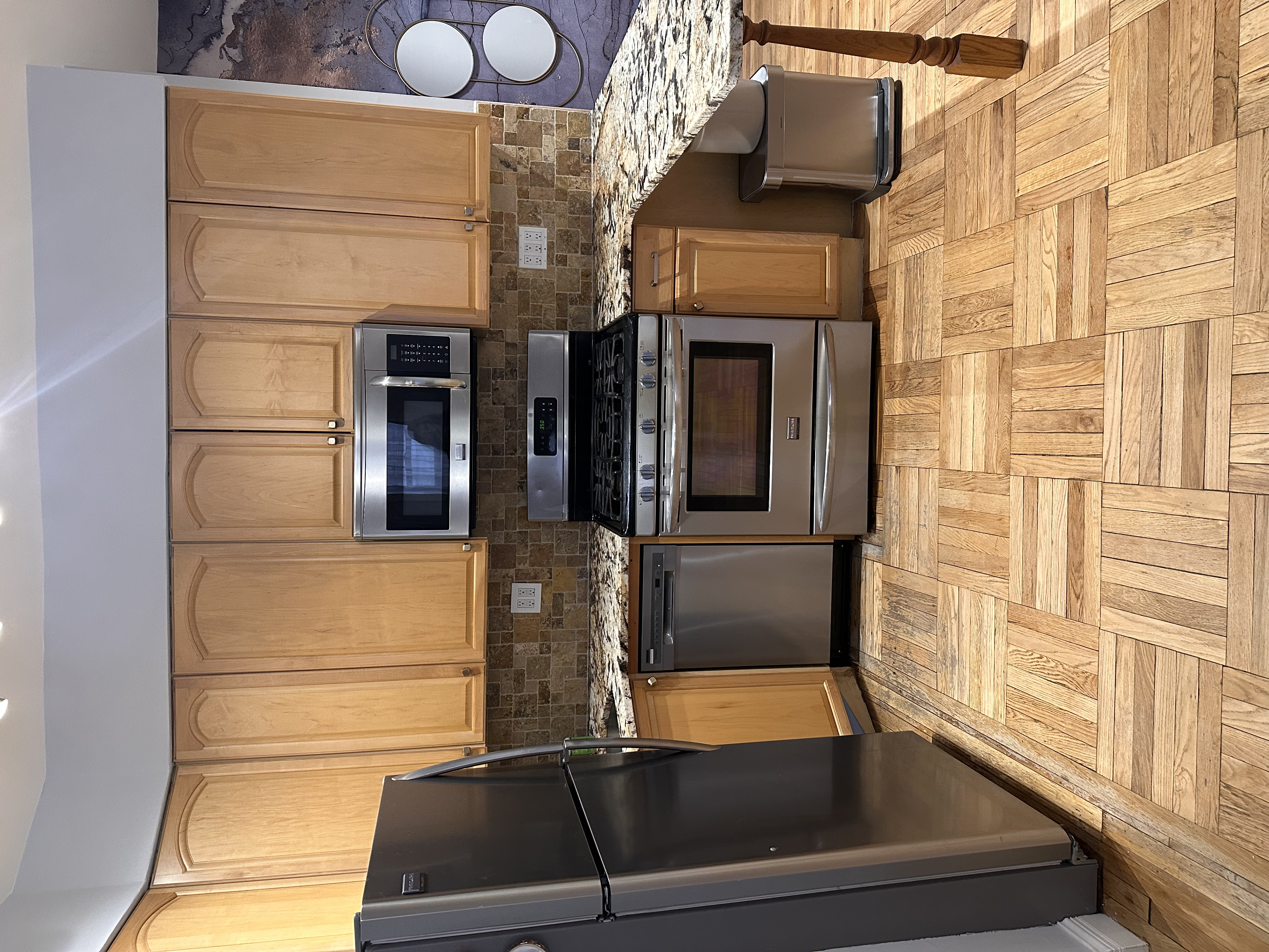 7101 Colonial Road, Unit L4G Brooklyn, NY 11209 - Photo 3 of 8 a kitchen with a stove top oven cabinets and a refrigerator