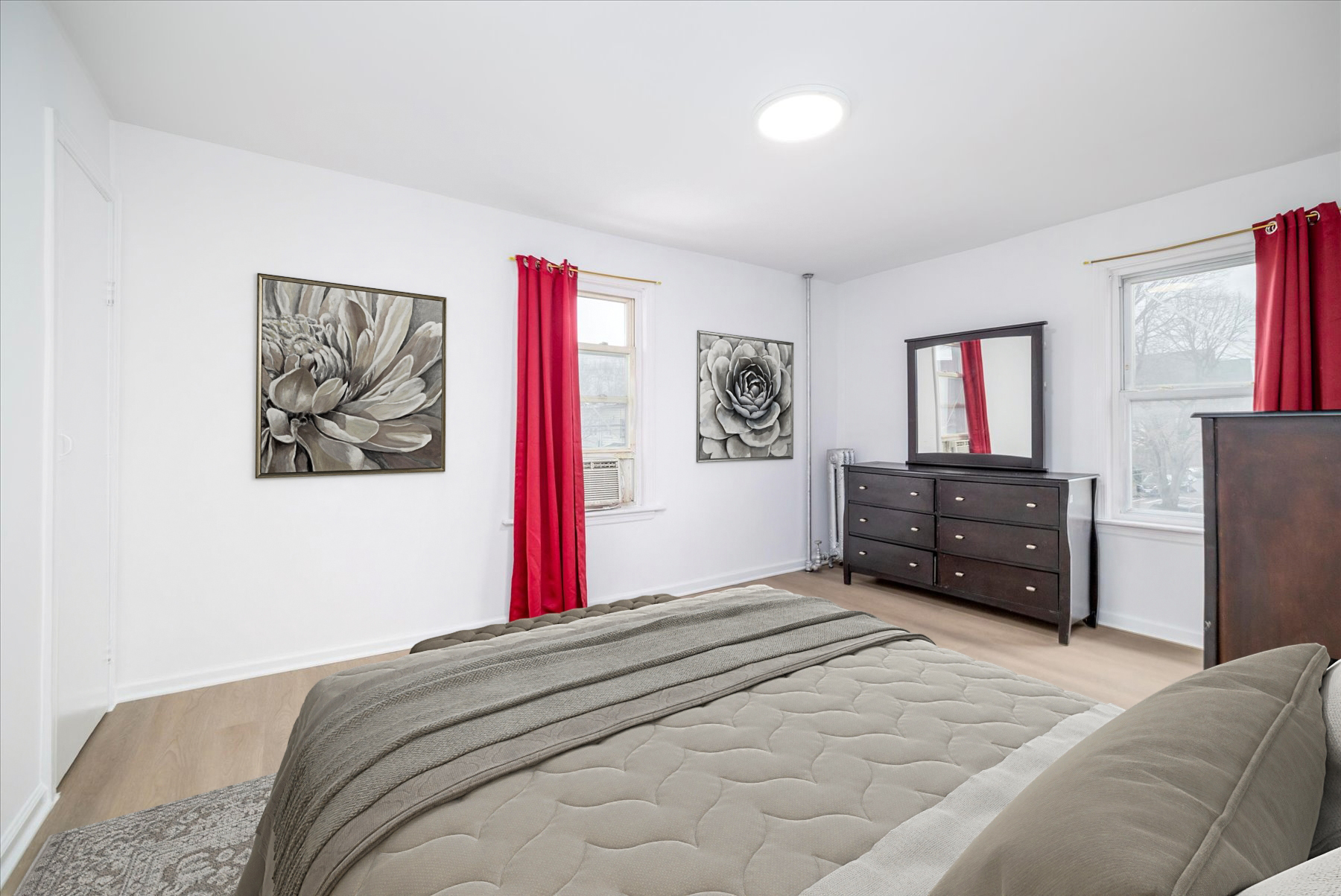 87-46 89th Street Queens, NY 11421 - Photo 10 of 25 a bedroom with a bed and a chandelier