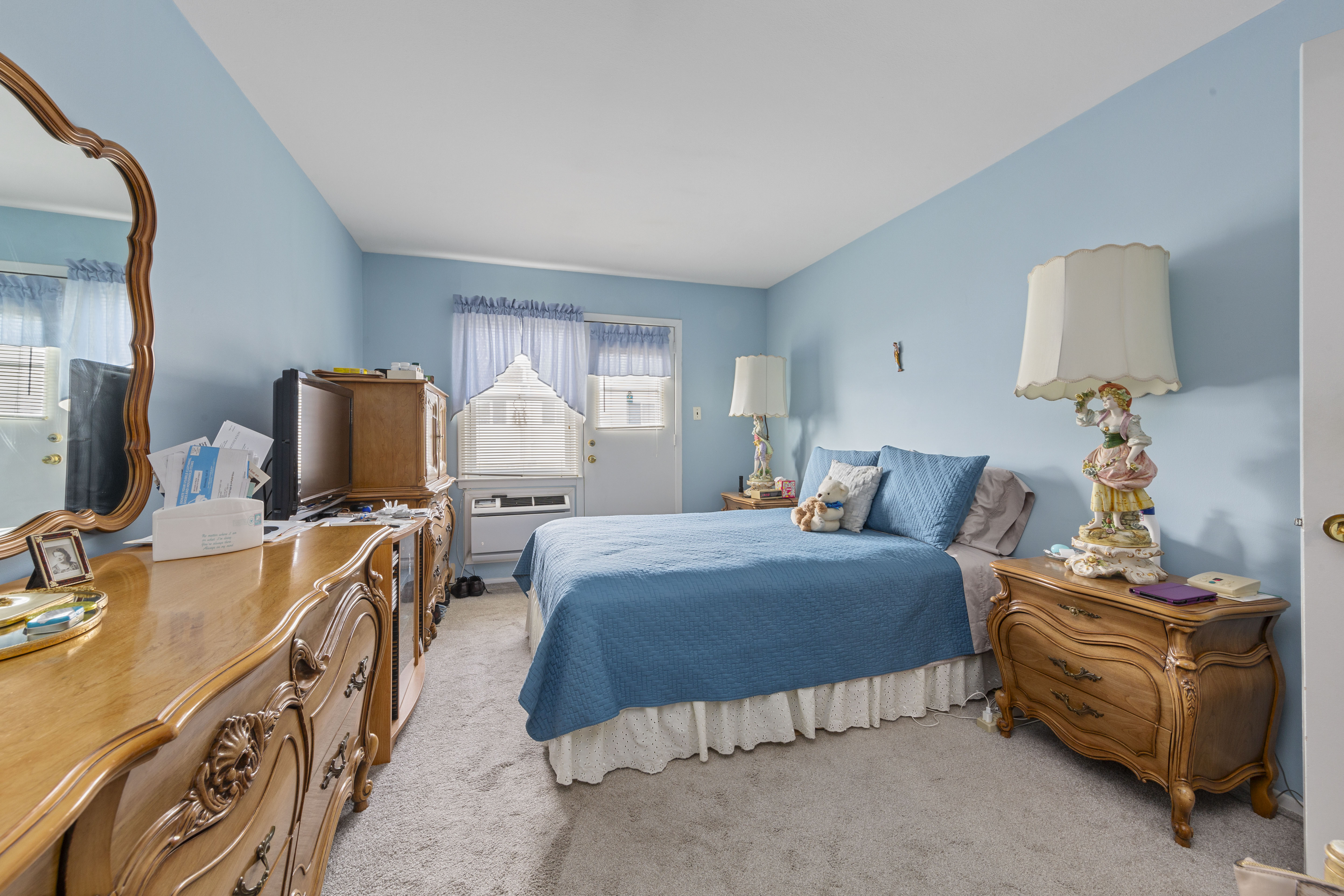 240-47 68th Avenue Queens, NY 11362 - Photo 9 of 39 a bedroom with a bed and furniture