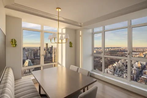a living room with dining table