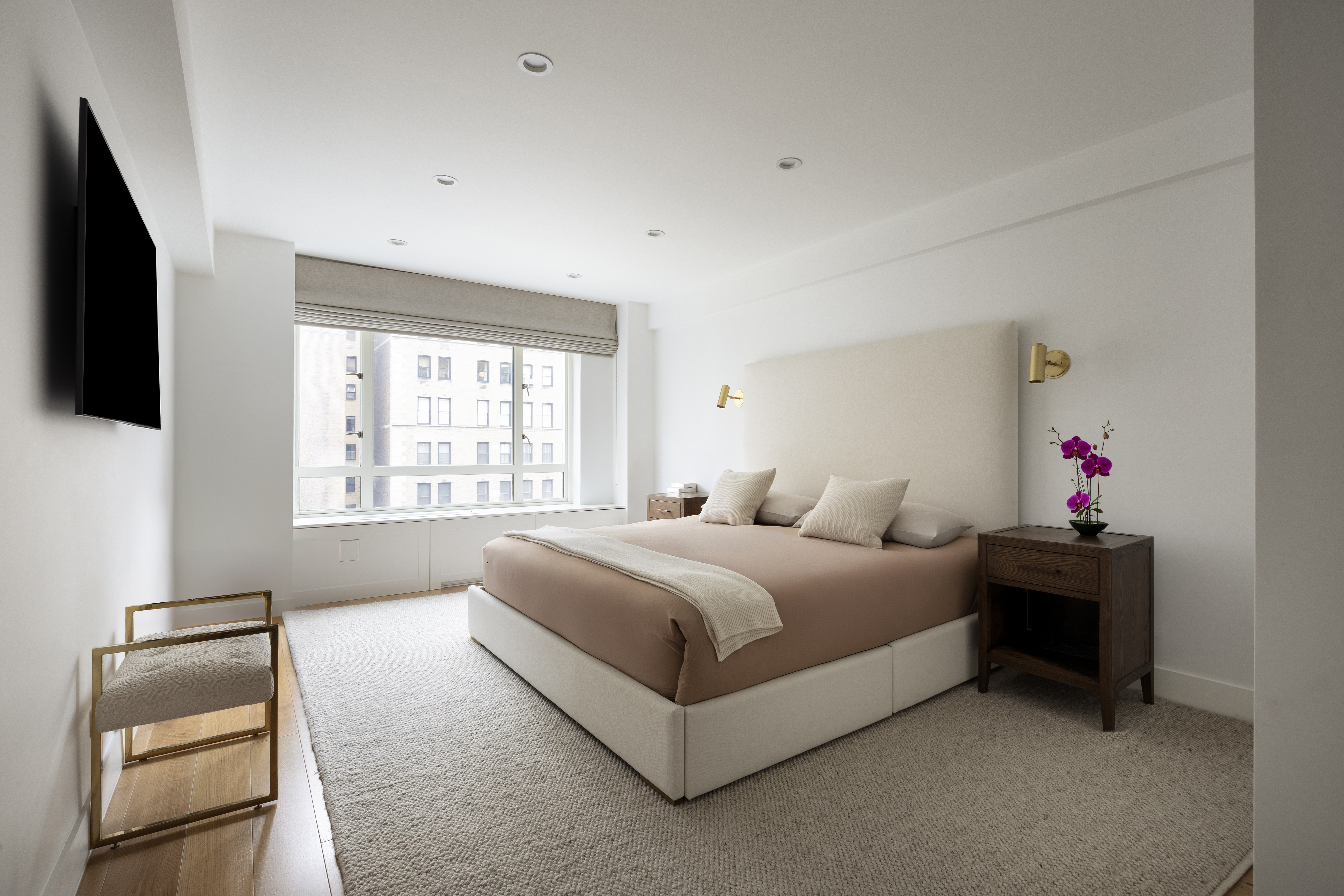 799 Park Avenue, Unit 10A Manhattan, NY 10021 - Photo 6 of 12 a spacious bedroom with a bed and a window
