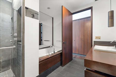 a bathroom with a double vanity sink and mirror