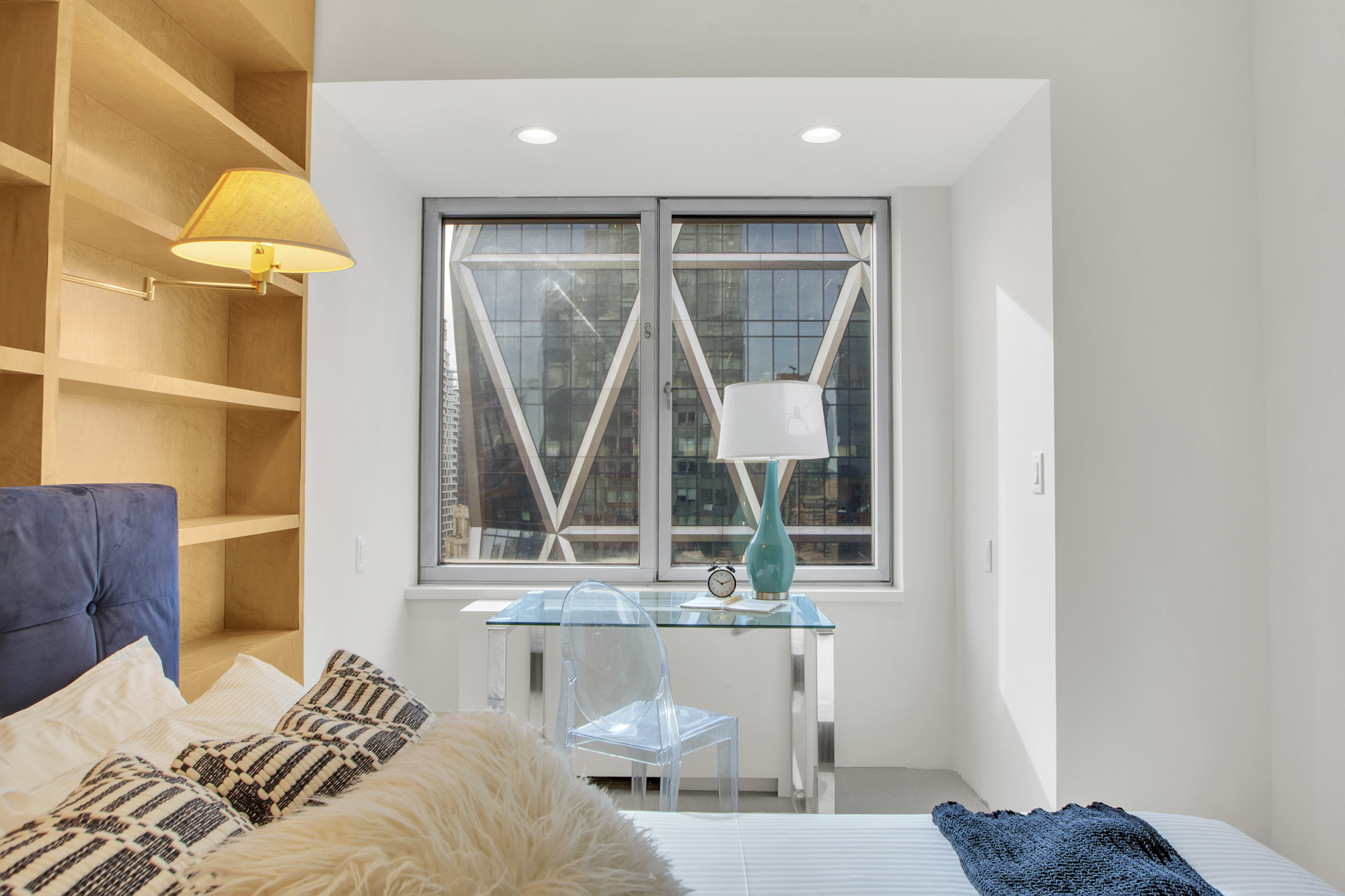 301 West 57th Street, Unit 48A Manhattan, NY 10019 - Photo 19 of 22 a bedroom with a bed and a window