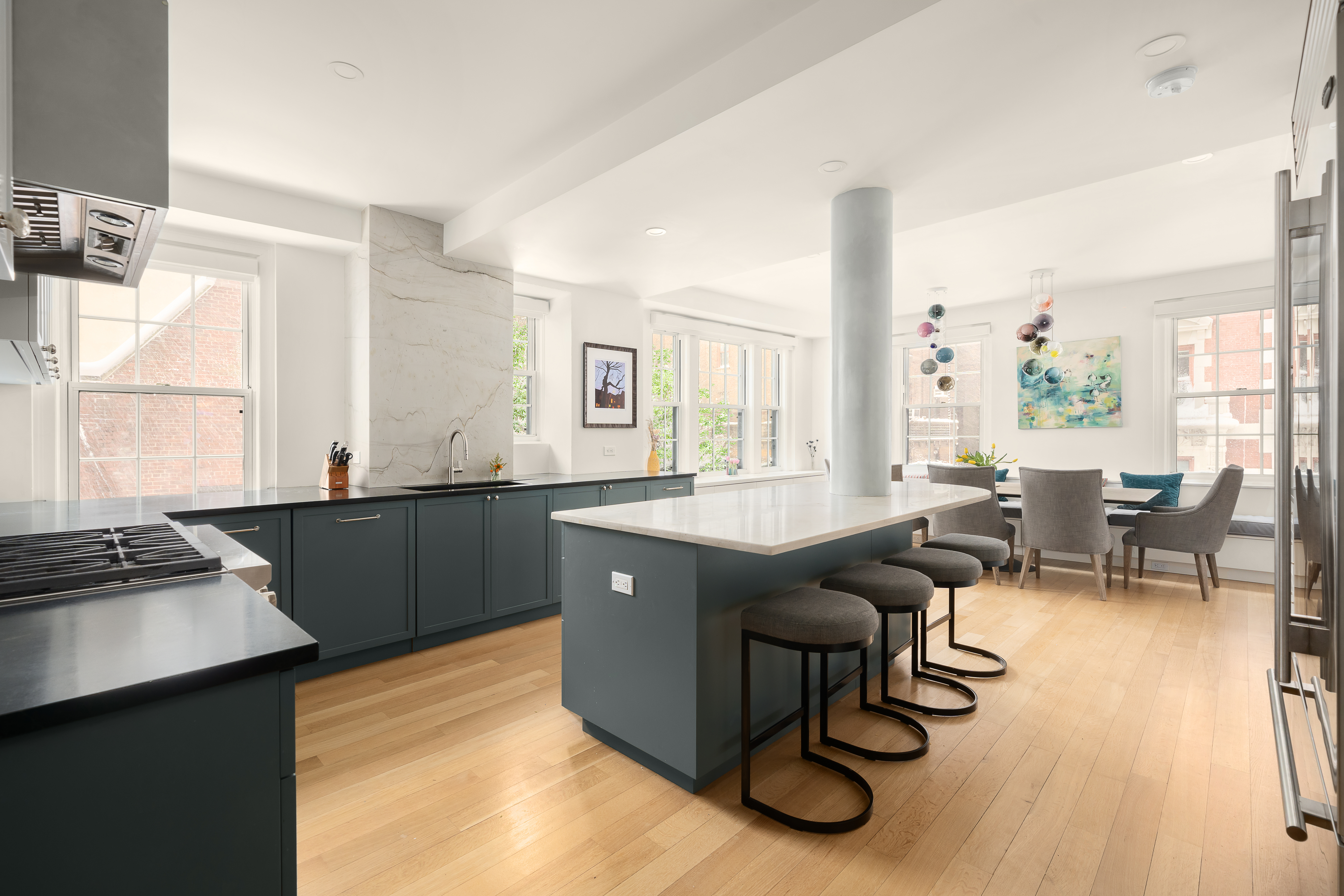 160 Henry Street, Unit 3C Brooklyn, NY 11201 - Photo 4 of 18 a living room with granite countertop furniture a large window and a dining table