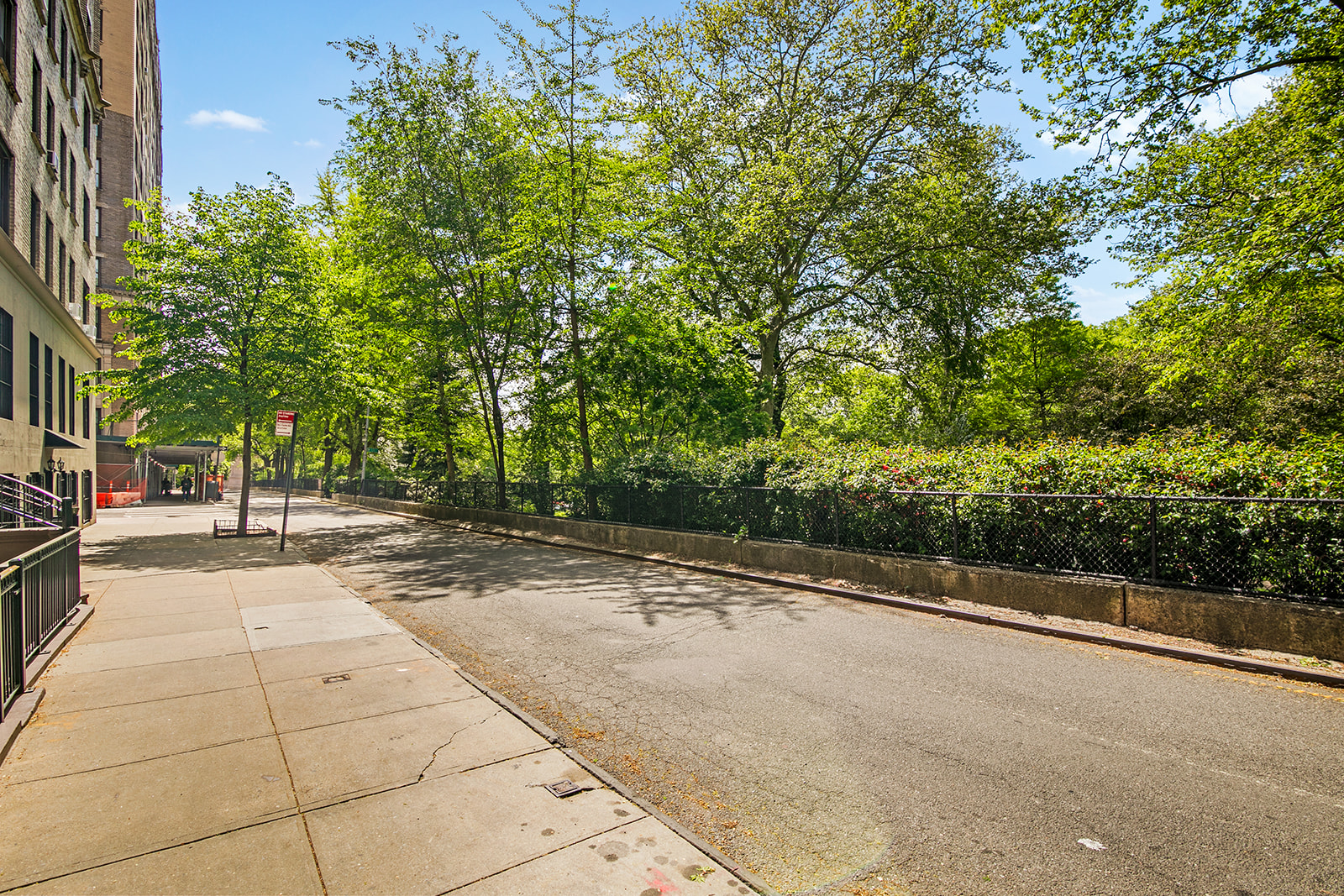 293 Riverside Drive, Unit 5B Manhattan, NY 10025 - Photo 9 of 10 a view of a street with trees on both side of it