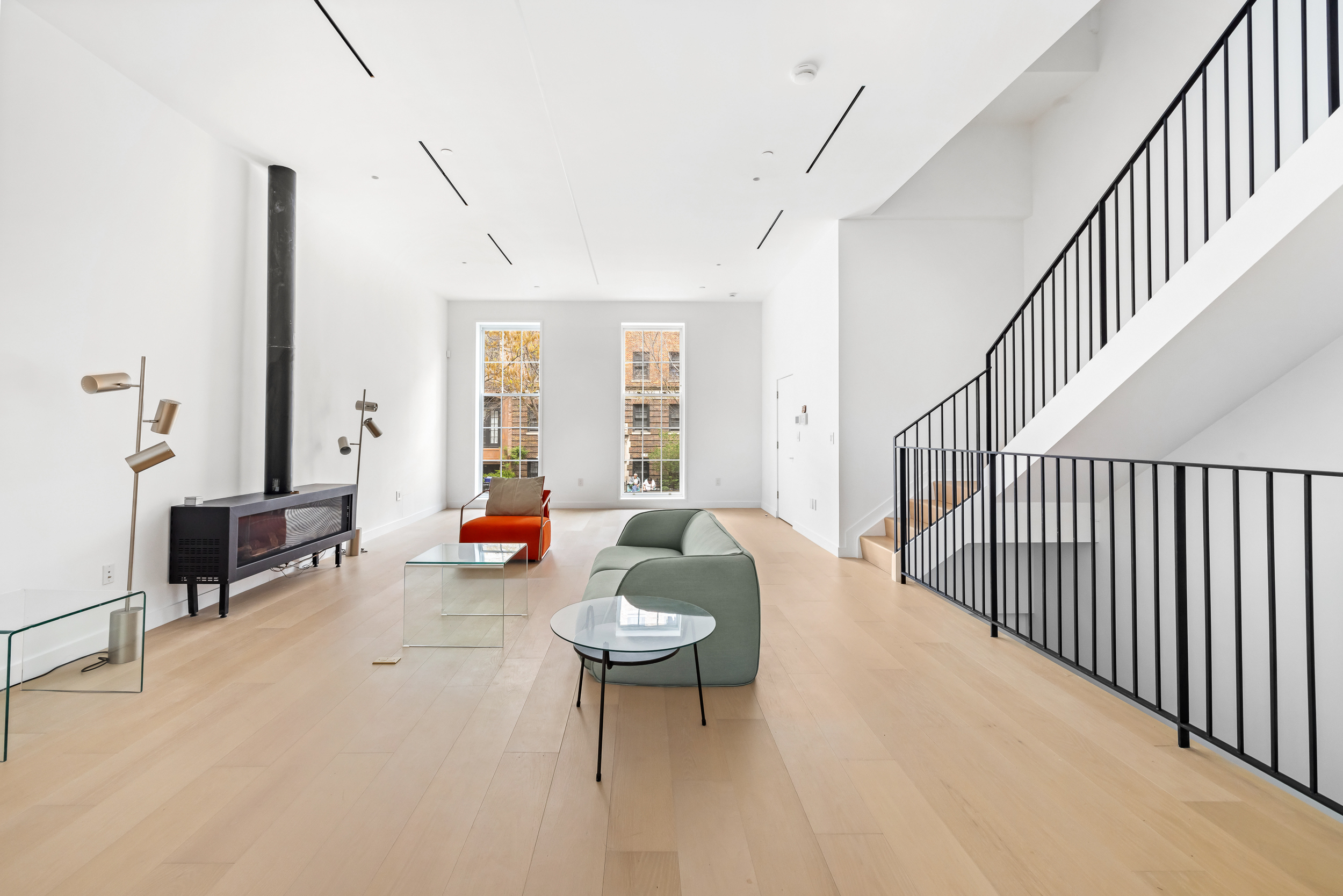 442 West 22nd Street Manhattan, NY 10011 - Photo 1 of 17 a living room with furniture and a dining table