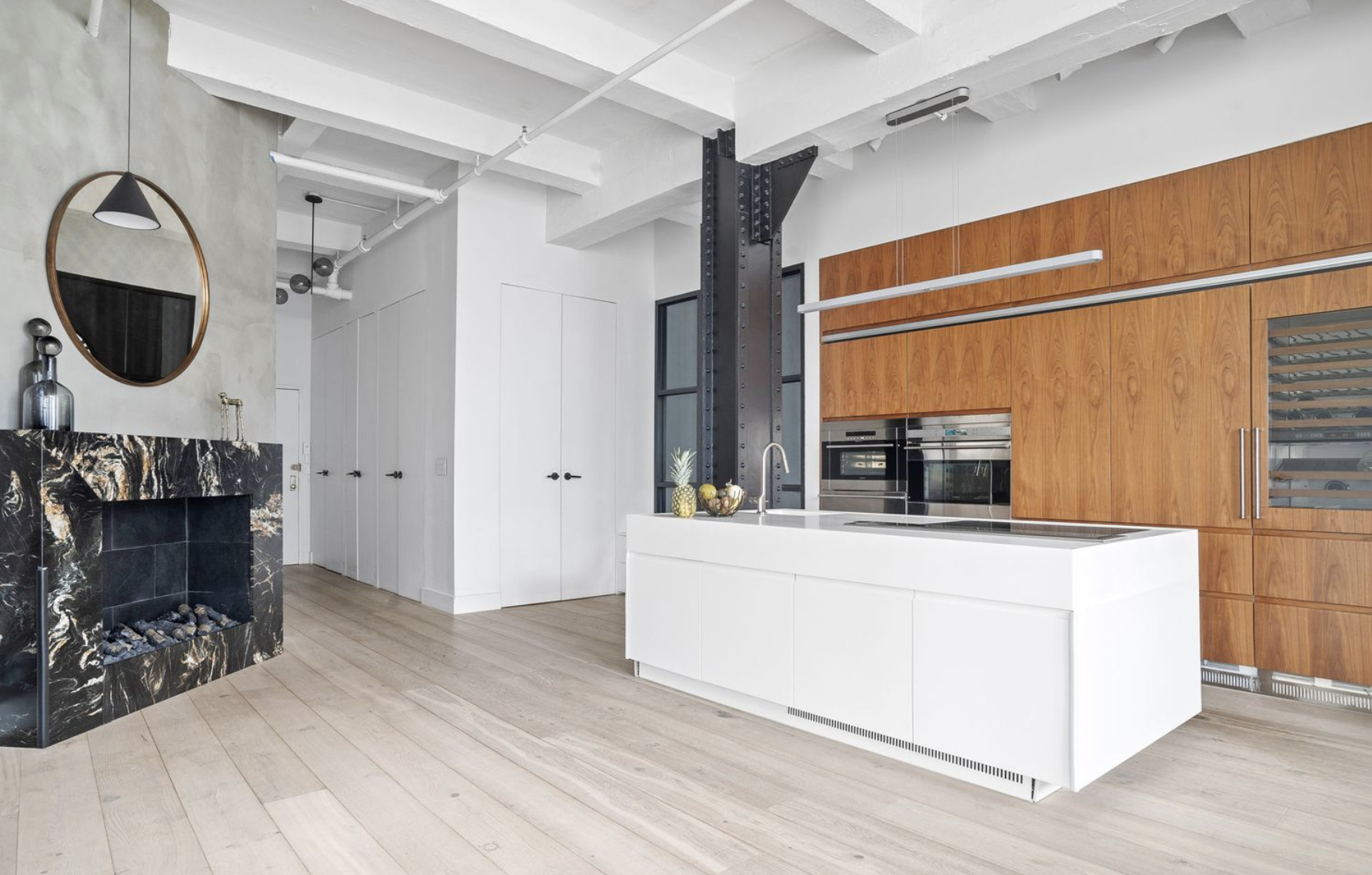 448 West 37th Street, Unit 8C Manhattan, NY 10018 - Photo 4 of 10 a view of living room with washer and dryer