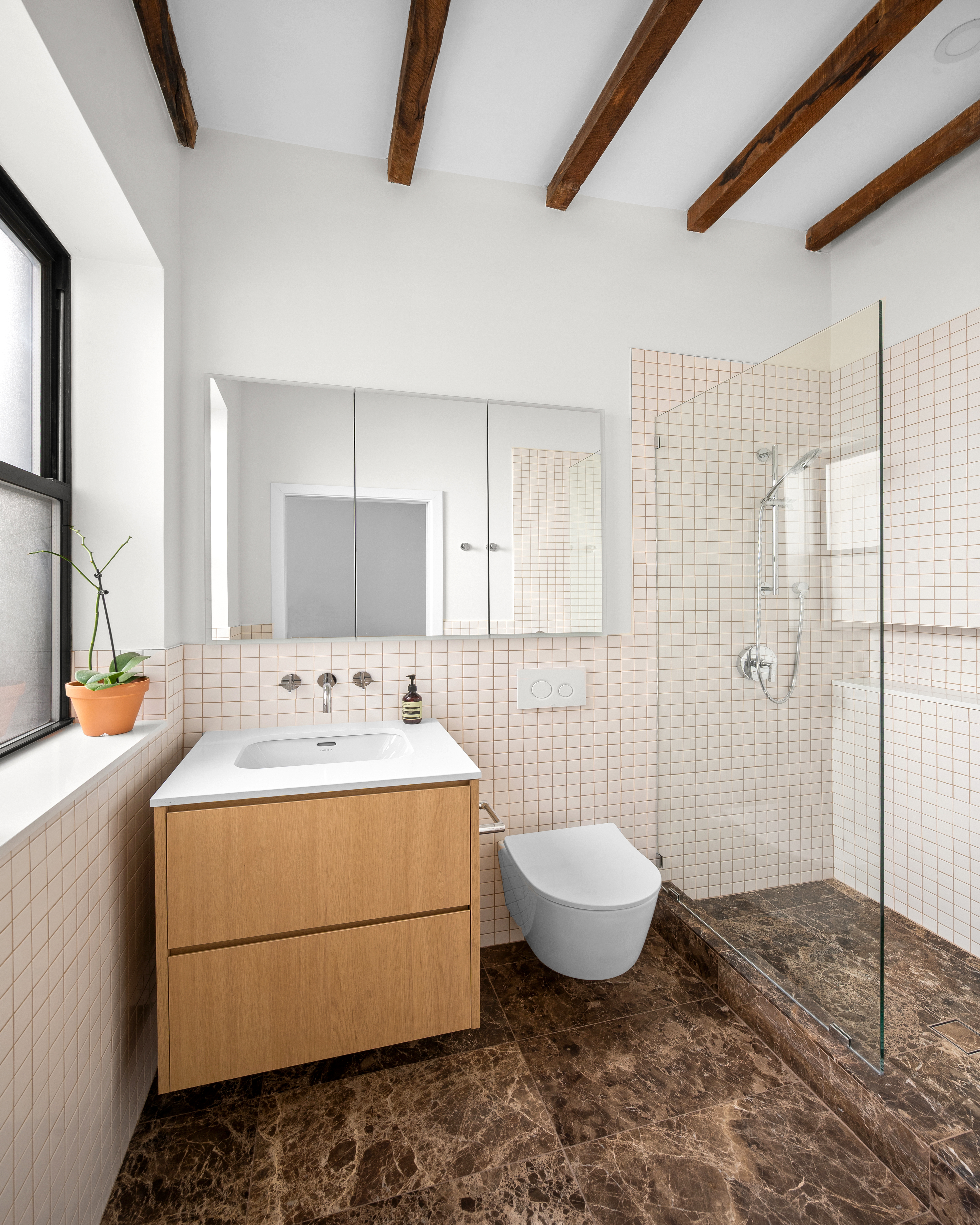 206 West 85th Street, Unit 5 Manhattan, NY 10024 - Photo 6 of 15 a bathroom with a sink toilet and shower