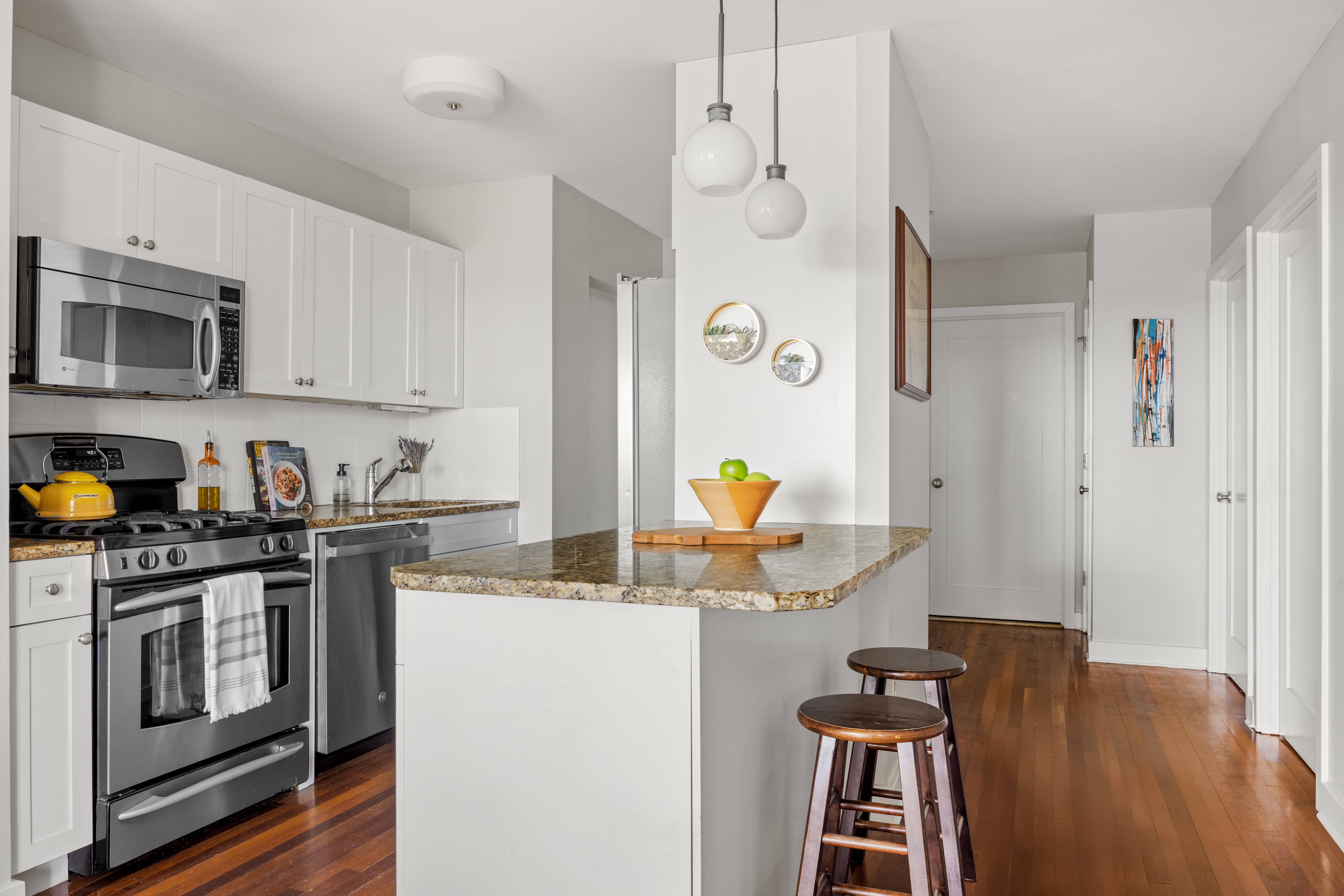 93 Rapelye Street, Unit 6C Brooklyn, NY 11231 - Photo 5 of 14 a kitchen with stainless steel appliances a stove a sink a microwave a refrigerator a cabinets and wooden floor