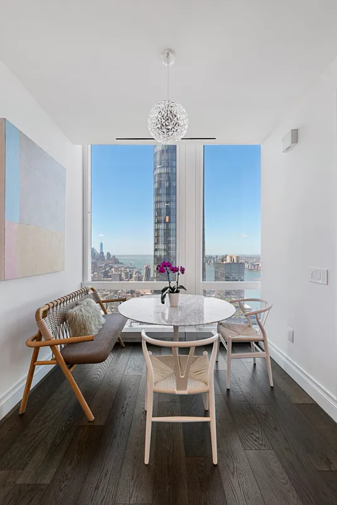 35 Hudson Yards, Unit 6701 Manhattan, NY 10001 - Photo 7 of 23 a view of a dining room with furniture window and wooden floor