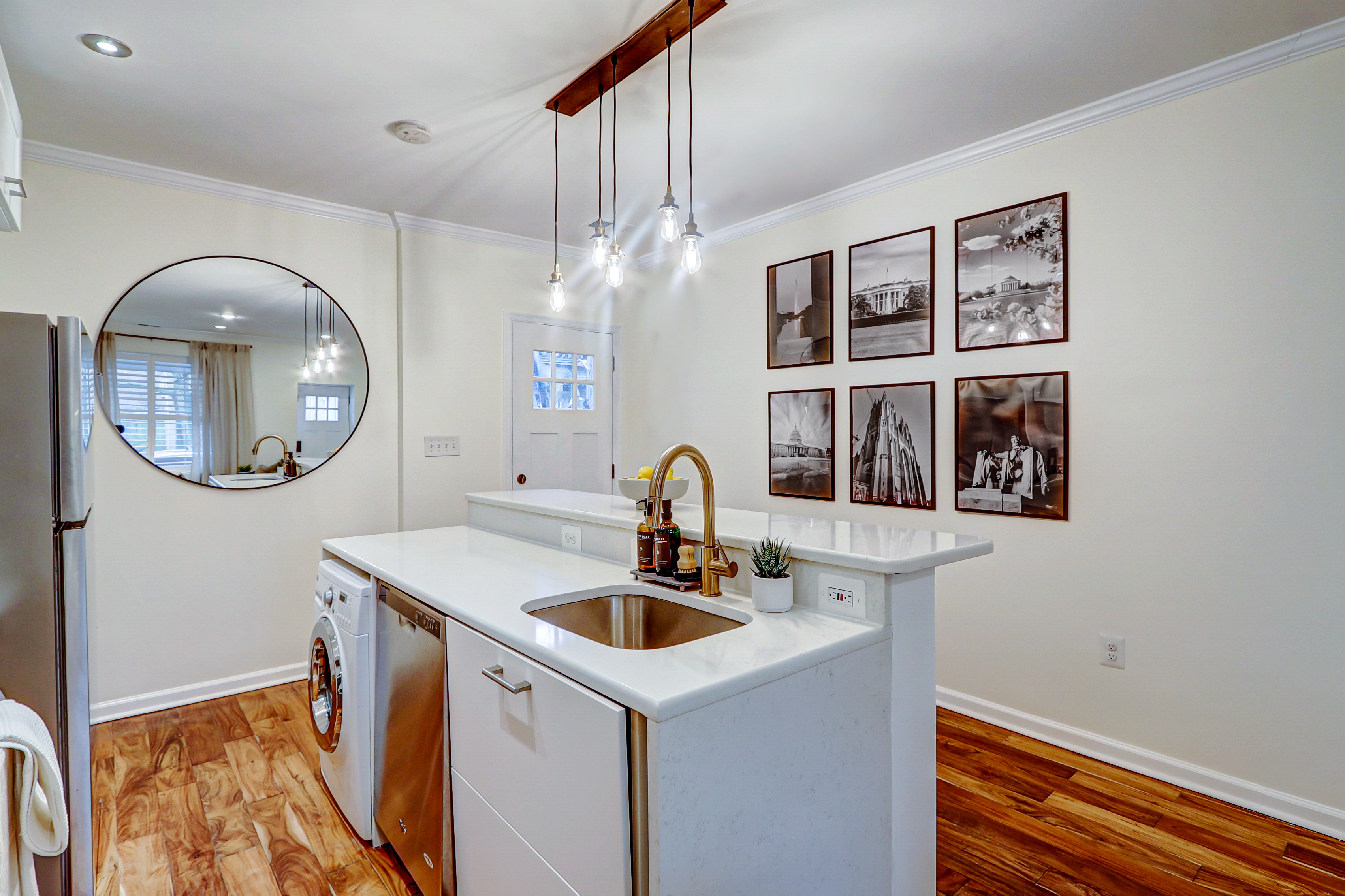 1003 P Street Northwest Washington, DC 20001 - Photo 8 of 34 a kitchen with a sink and a chandelier
