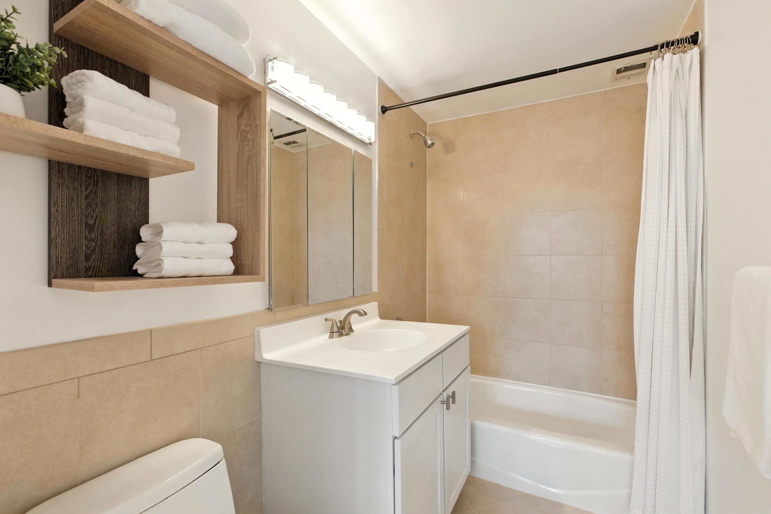 1787 Madison Avenue, Unit 402 Manhattan, NY 10035 - Photo 5 of 13 a bathroom with a bathtub a sink and a shower