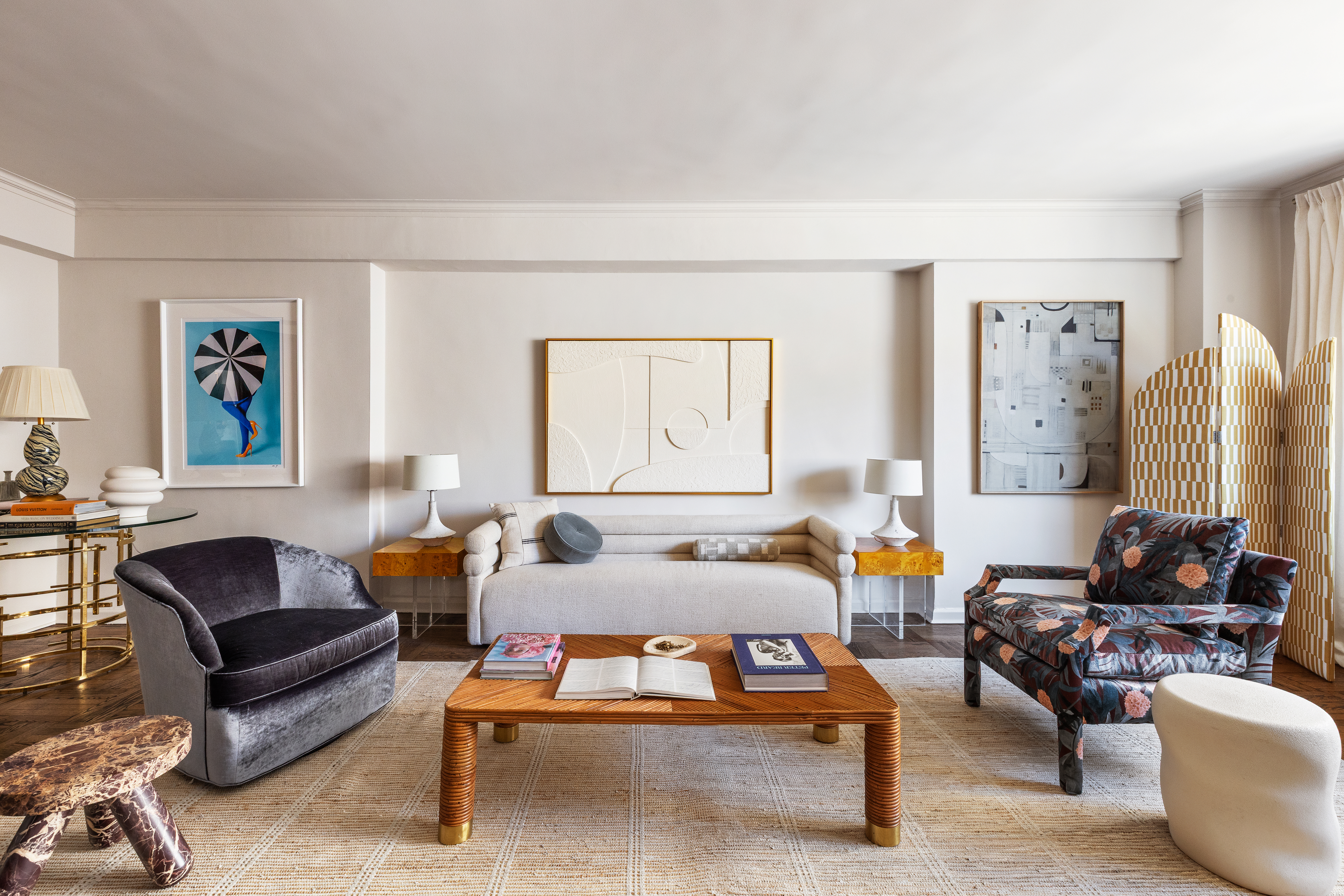 860 5th Avenue, Unit 12E Manhattan, NY 10065 - Photo 1 of 16 a living room with furniture and a large window
