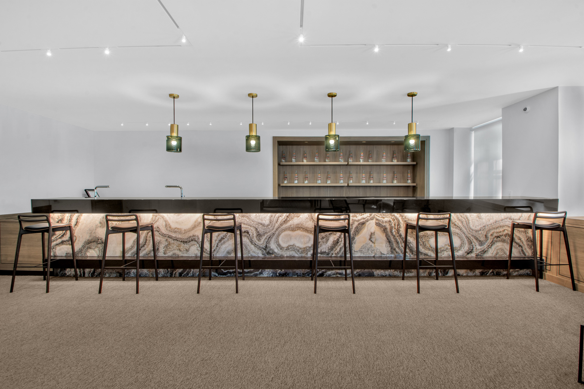 333 Rector Place, Unit 408 Manhattan, NY 10280 - Photo 10 of 12 a kitchen with stainless steel appliances kitchen island granite countertop a stove a sink and a refrigerator