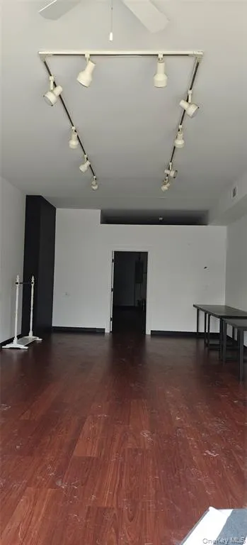 a view of a room with lots of space and a hallway