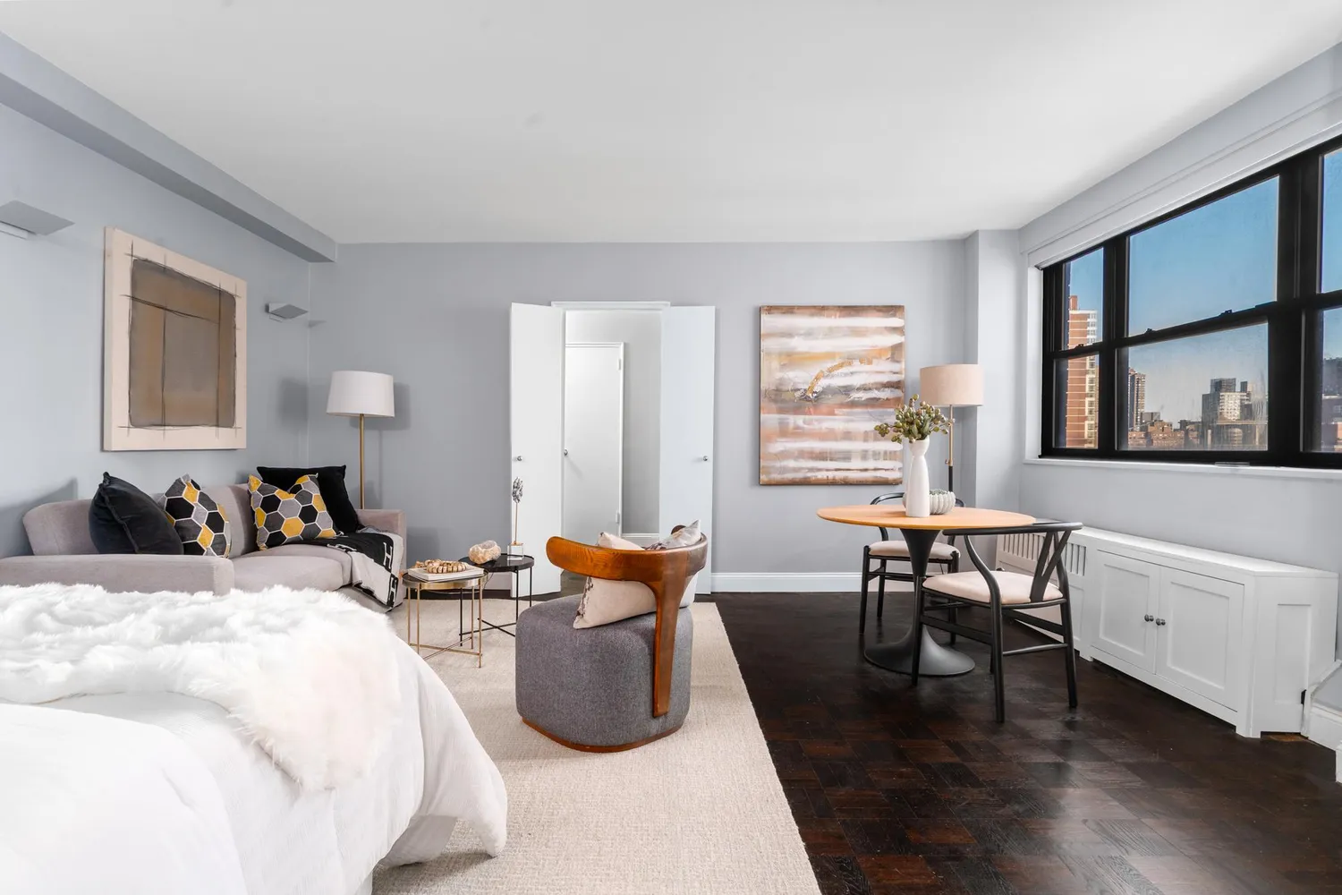 a bed room with furniture and a window