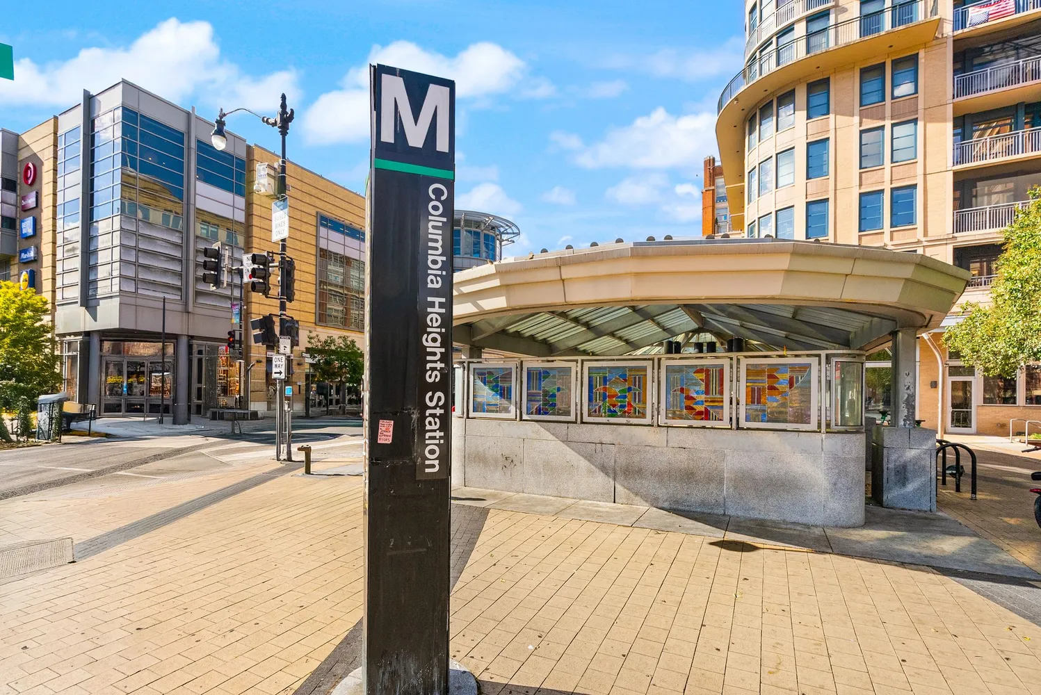 a view of a patio with table and chairs potted plants and large tree