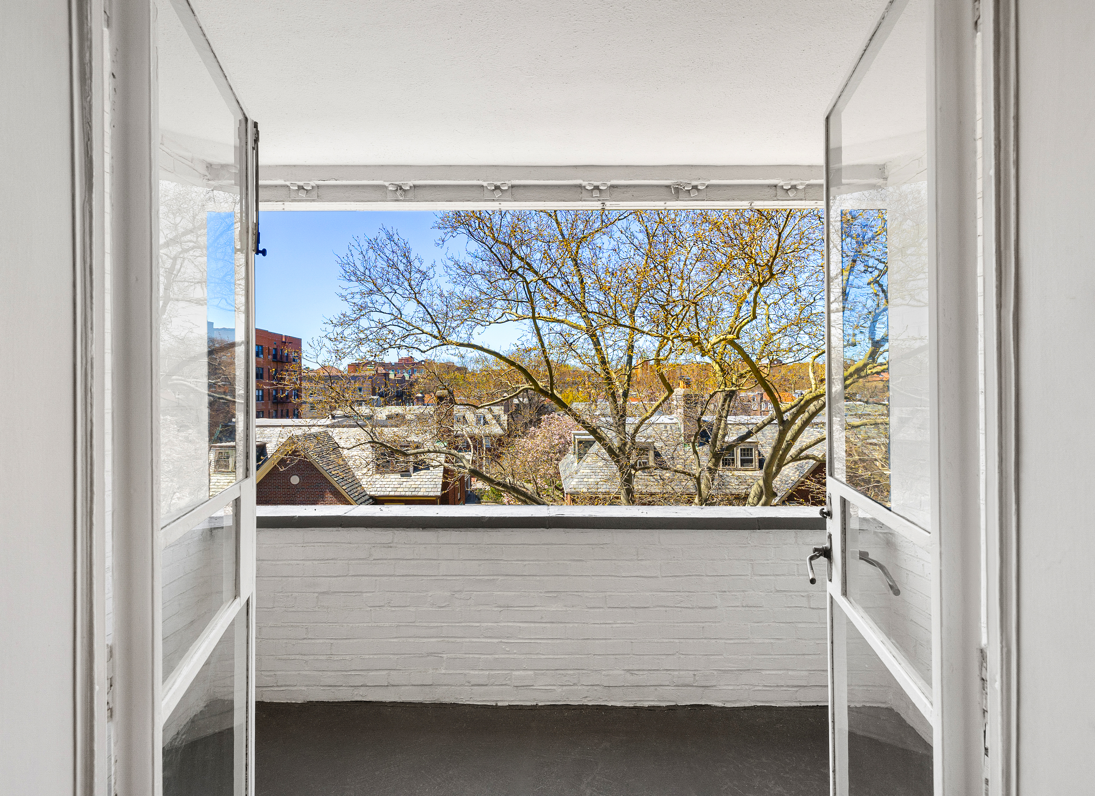 34-41 85th Street, Unit 4R Queens, NY 11372 - Photo 10 of 19 a view of a door and bench