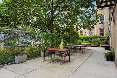 a view of a tables and chairs in a patio