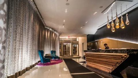 a view of lobby with furniture and gym equipment