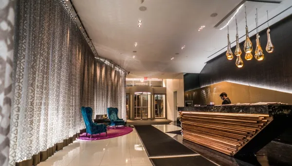 a view of lobby with furniture and gym equipment